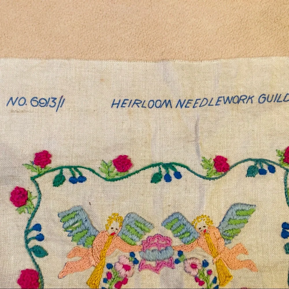 Beautiful small sampler of newborn child, knitted in colorful needlework linen